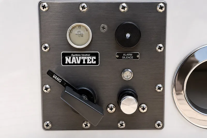 Slide: The Image of Control panel of a 1989 Mason 54 yacht featuring Navtec systems and alarm silence button. - 19