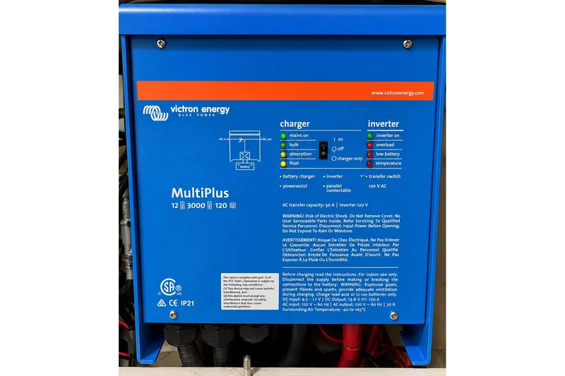 Slide: The Image of Victron Energy MultiPlus inverter charger, blue, model 12/3000/120, with control indicators and safety warnings. - 41