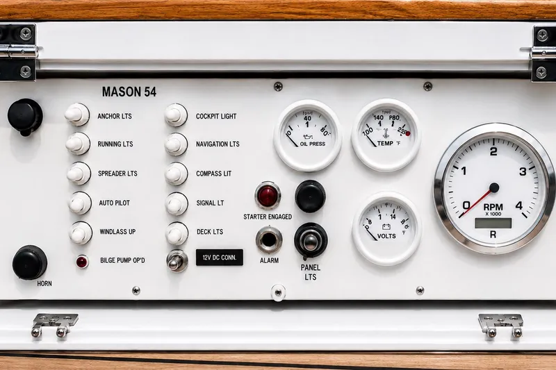 Slide: The Image of Control panel of a 1989 Mason 54 boat with gauges and switches. - 20
