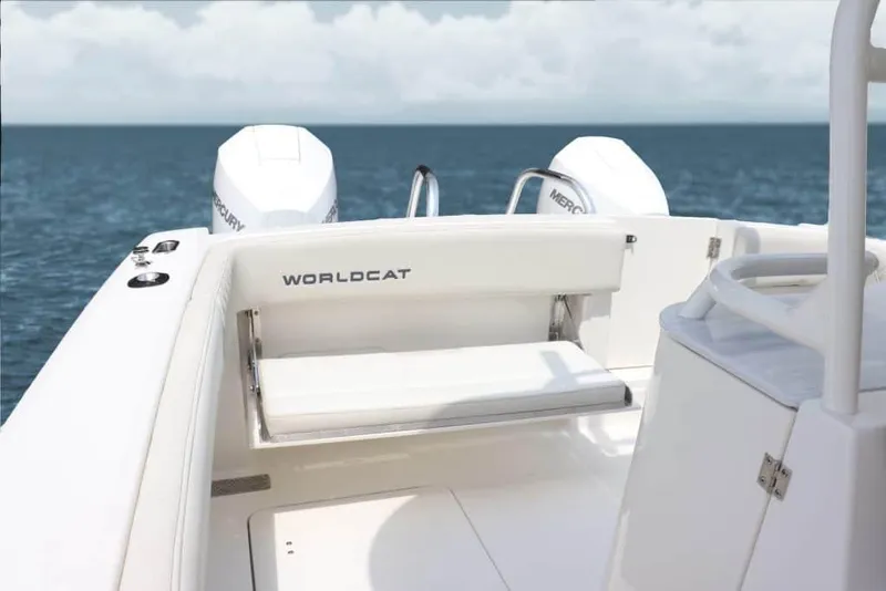 Slide: The Image of Manufacturer Provided Image: 2026 World Cat 280 CC-X boat interior with dual Mercury engines, ocean backdrop. - 9