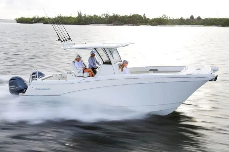 Slide: The Image of Manufacturer Provided Image: 2026 World Cat 280 CC-X cruising on water with passengers, showcasing sleek design and performance. - 1