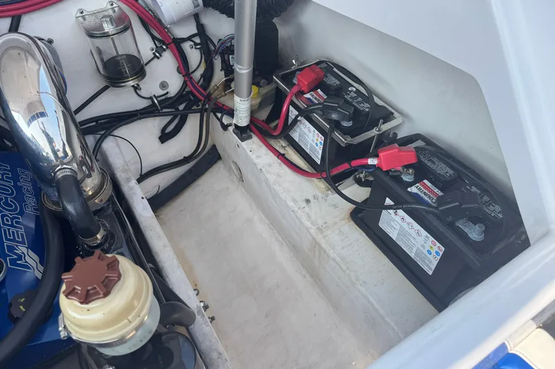 Slide: The Image of Engine compartment of a 2009 Donzi 27 ZR boat with batteries and wiring. - 10