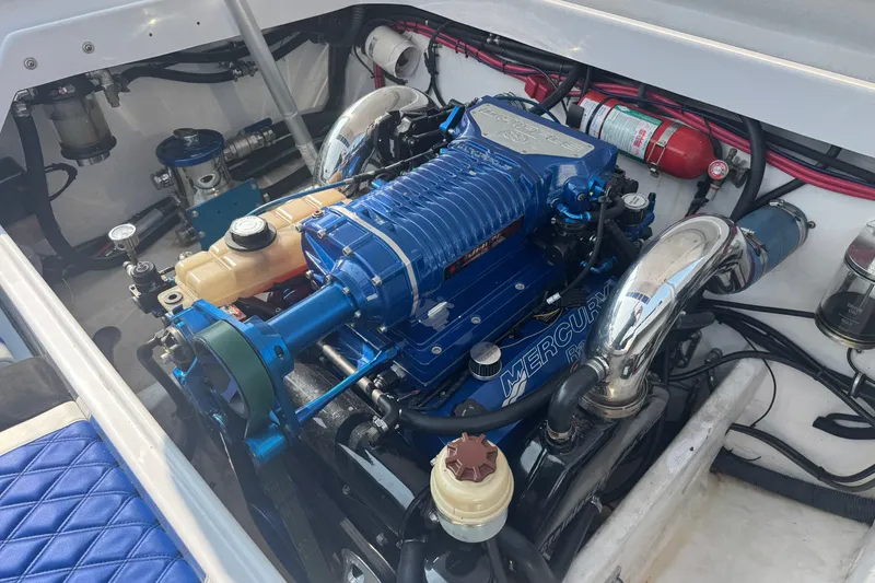 Slide: The Image of Engine compartment of a 2009 Donzi 27 ZR boat featuring a Mercury engine. - 9