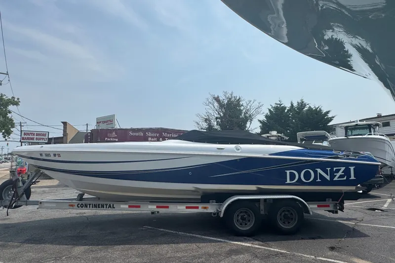 Slide: The Image of 2009 Donzi 27 ZR speedboat on trailer at South Shore Marine Supply. - 4