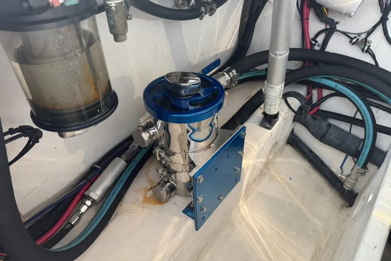 Slide: The Image of Engine compartment of a 2009 Donzi 27 ZR boat, featuring fuel system components. - 8