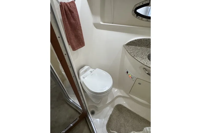 Slide: The Image of Bathroom interior of 2005 Chaparral Signature 350 yacht with toilet and sink. - 17
