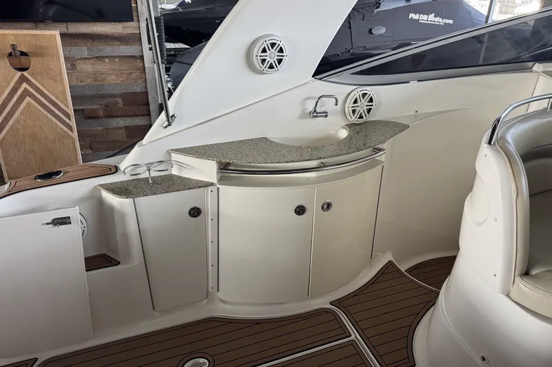 Slide: The Image of 2005 Chaparral Signature 350 boat interior with sink and storage cabinets. - 6