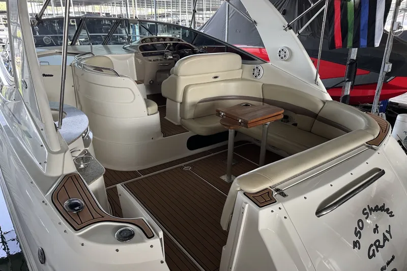 Slide: The Image of 2005 Chaparral Signature 350 yacht interior with seating and table, named "350 Shades of Gray." - 4