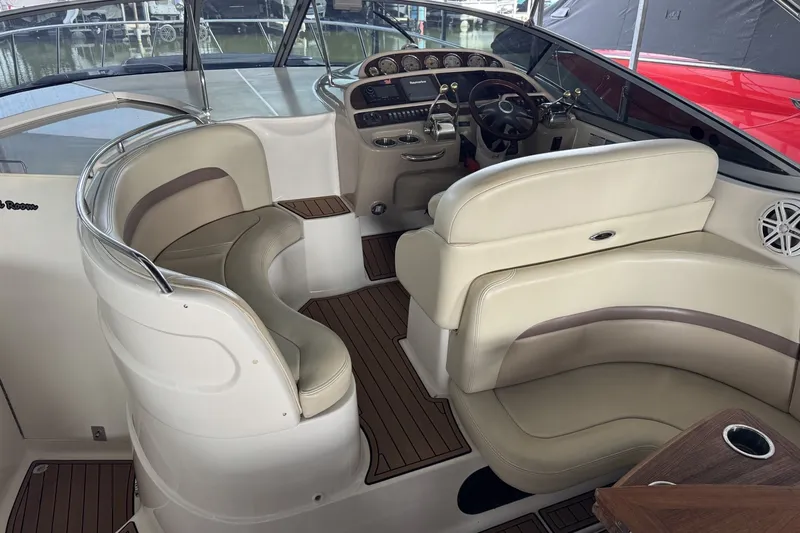 Slide: The Image of 2005 Chaparral Signature 350 boat interior with beige seating and wood accents. - 5