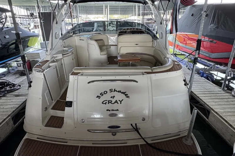 Slide: The Image of 2005 Chaparral Signature 350 boat docked, featuring spacious seating and elegant design. - 3