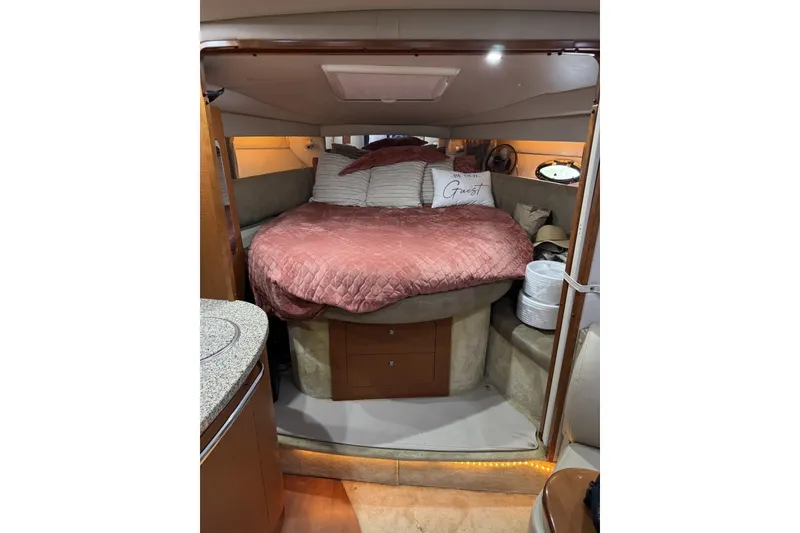 Slide: The Image of Interior of 2005 Chaparral Signature 350 yacht with cozy bed and elegant decor. - 12
