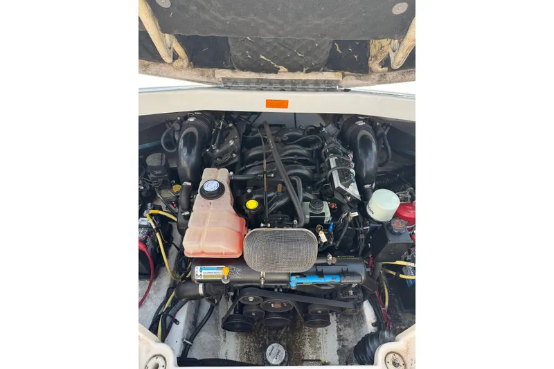 Slide: The Image of Engine compartment of a 2003 CHAPPARRAL 260 SSI boat, showcasing detailed components. - 7