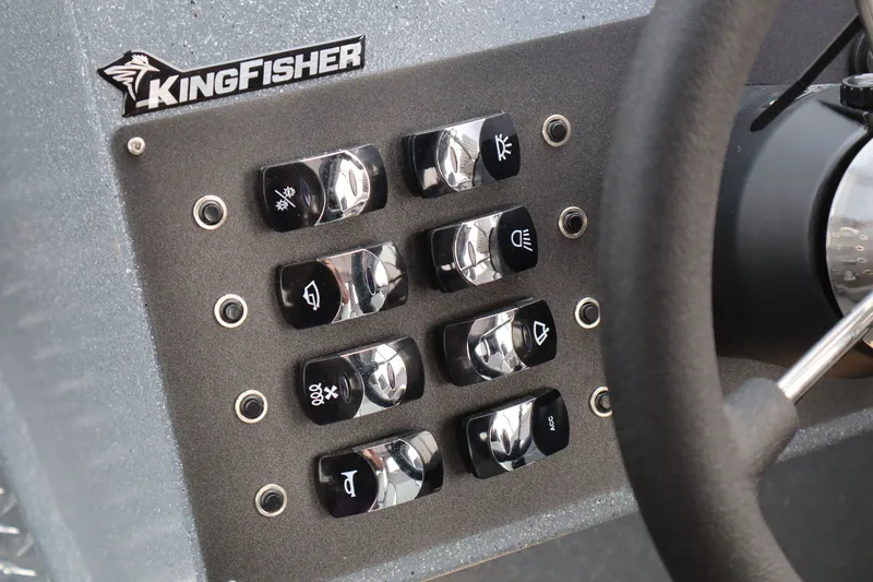Slide: The Image of Control panel of 2026 KingFisher 2225 Escape HT boat with labeled switches. - 24
