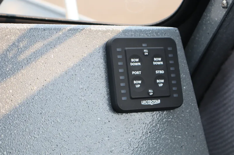 Slide: The Image of Control panel on 2026 KingFisher 2225 Escape HT boat, featuring Lectrotab trim tab controls. - 25