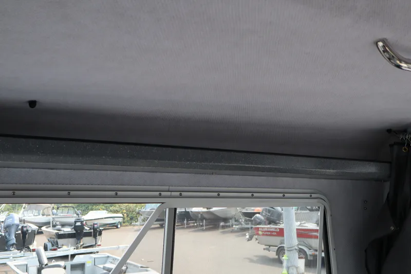 Slide: The Image of Interior view of 2026 KingFisher 2225 Escape HT boat, showcasing window and ceiling details. - 39