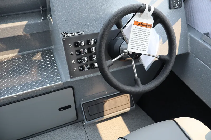 Slide: The Image of Steering wheel of 2026 KingFisher 2225 Escape HT boat with control panel. - 23