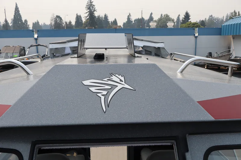 Slide: The Image of 2026 KingFisher 2225 Escape HT boat with sleek design and logo detail. - 34