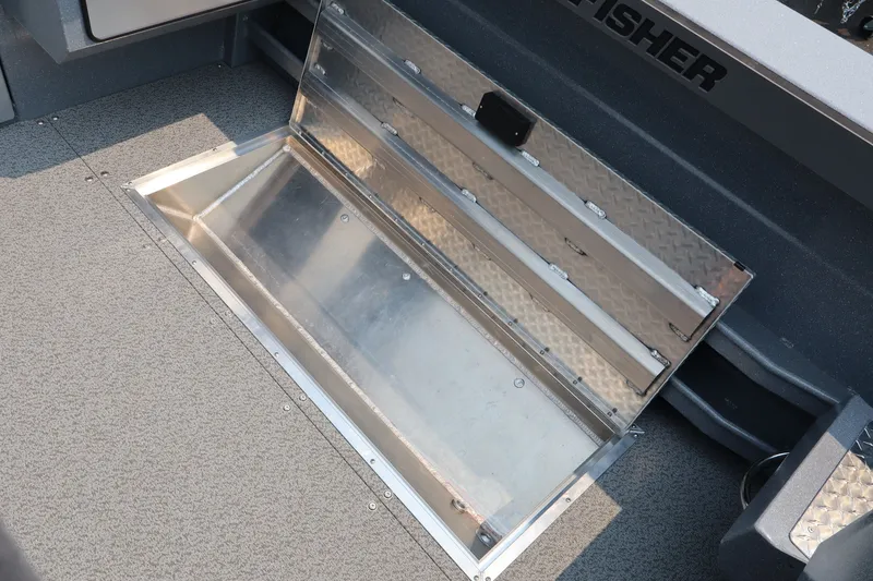 Slide: The Image of Open storage compartment on 2026 KingFisher 2225 Escape HT boat, featuring metal interior. - 14