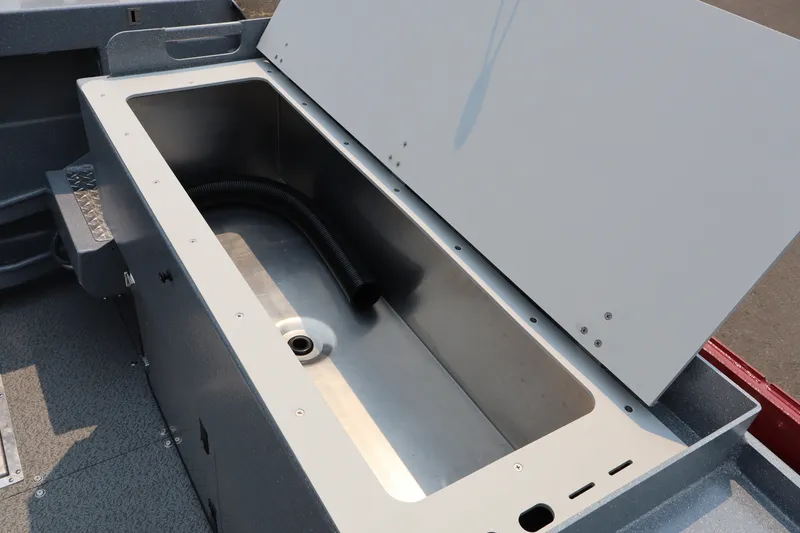 Slide: The Image of Open storage compartment on 2026 KingFisher 2225 Escape HT boat, showcasing interior design. - 9