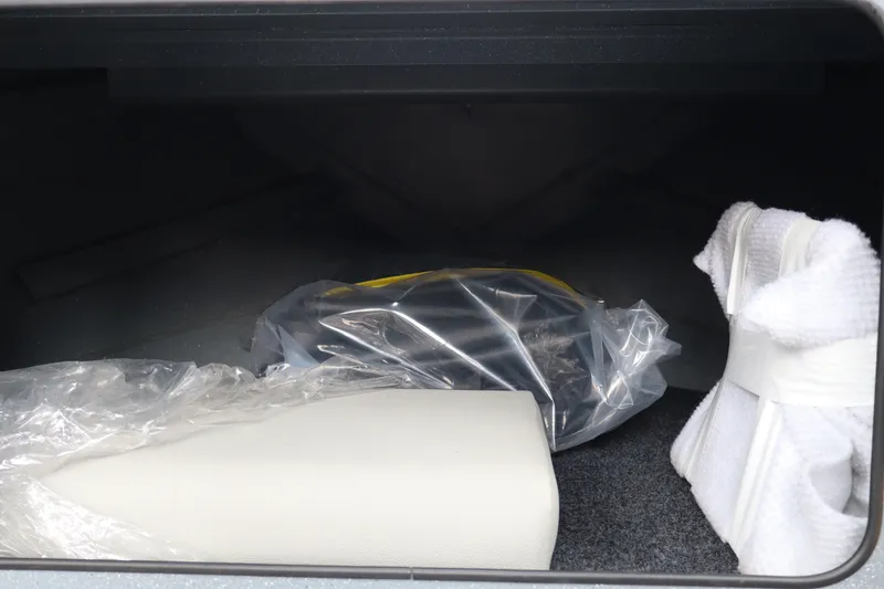 Slide: The Image of Storage compartment of 2026 KingFisher 2225 Escape HT with wrapped items inside. - 36