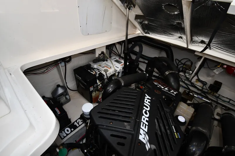 Slide: The Image of Engine compartment of a 2007 Sea Ray 340 Sundancer with Mercury engine and wiring. - 50