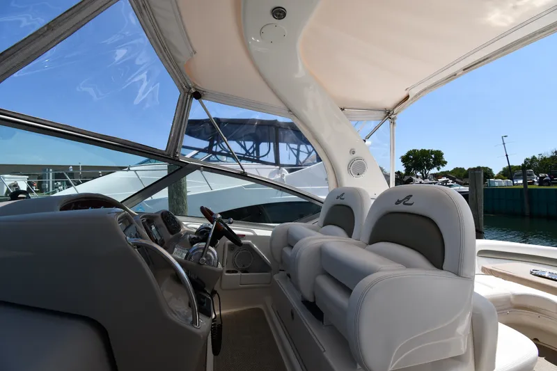 Slide: The Image of Interior view of 2007 Sea Ray 340 Sundancer yacht cockpit with helm and seating. - 15