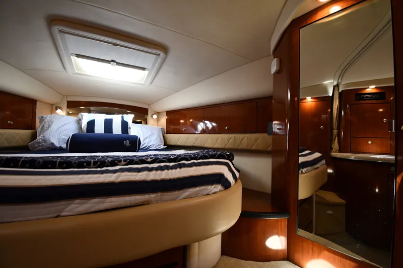 Slide: The Image of Luxurious cabin interior of 2007 Sea Ray 340 Sundancer yacht with elegant bedding. - 28