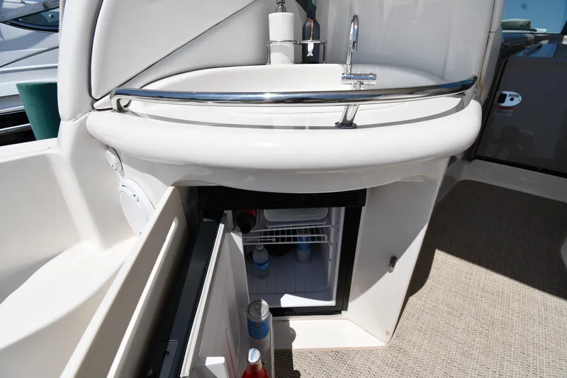 Slide: The Image of 2007 Sea Ray 340 Sundancer boat interior with sink and mini fridge. - 22