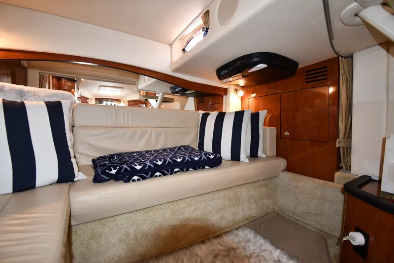 Slide: The Image of Luxurious interior of 2007 Sea Ray 340 Sundancer with plush seating and nautical decor. - 44