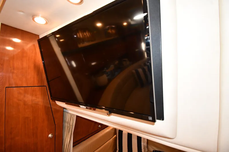 Slide: The Image of Flat-screen TV in the cabin of a 2007 Sea Ray 340 Sundancer yacht. - 45