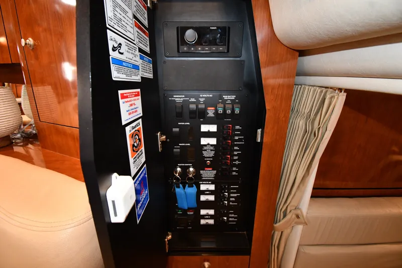 Slide: The Image of Electrical control panel inside a 2007 Sea Ray 340 Sundancer yacht cabin. - 46