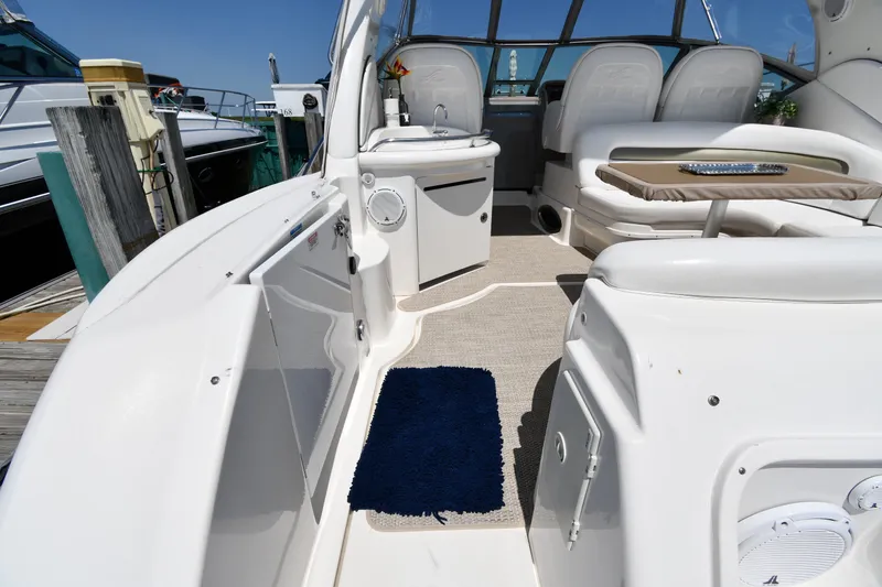 Slide: The Image of 2007 Sea Ray 340 Sundancer interior with seating, table, and helm station. - 23