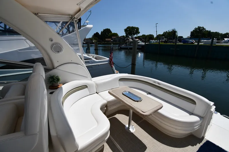 Slide: The Image of Luxurious 2007 Sea Ray 340 Sundancer yacht interior with elegant seating and table by the water. - 20