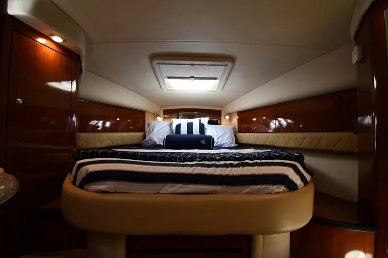 Slide: The Image of Luxurious cabin interior of 2007 Sea Ray 340 Sundancer yacht with cozy bedding. - 27