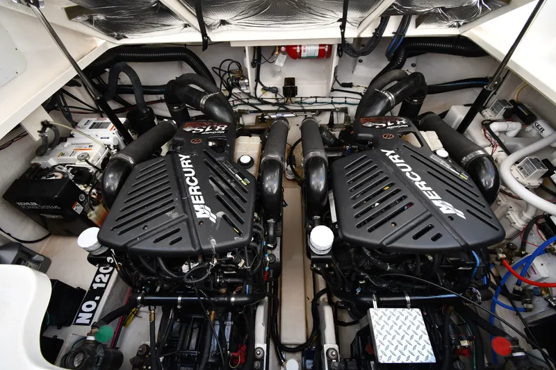 Slide: The Image of Engine room of a 2007 Sea Ray 340 Sundancer with twin Mercury engines. - 48