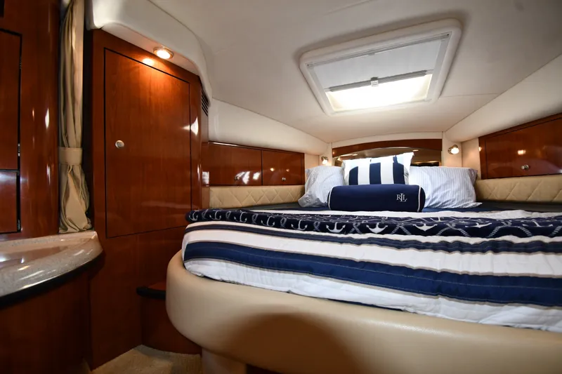 Slide: The Image of Luxurious cabin interior of 2007 Sea Ray 340 Sundancer yacht with cozy bedding. - 29