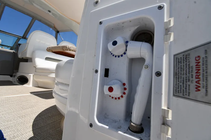 Slide: The Image of 2007 Sea Ray 340 Sundancer interior with shower controls and seating area. - 24