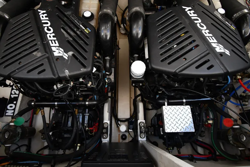 Slide: The Image of Twin Mercury engines in a 2007 Sea Ray 340 Sundancer boat engine compartment. - 51