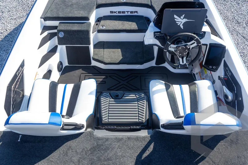 Slide: The Image of 2027 Skeeter FXE21 Limited boat interior with dual seats and advanced steering console. - 22