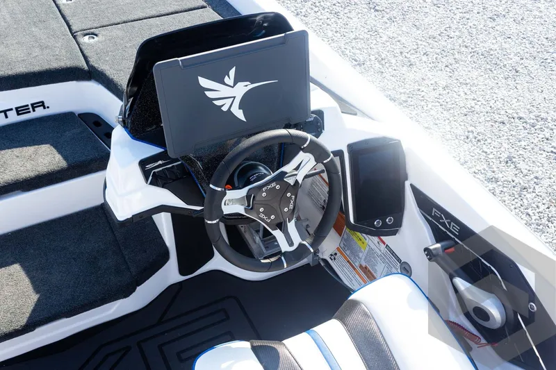 Slide: The Image of 2027 Skeeter FXE21 Limited boat cockpit with advanced steering and digital display. - 23