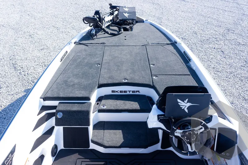 Slide: The Image of 2027 Skeeter FXE21 Limited boat deck with advanced steering and control systems. - 17