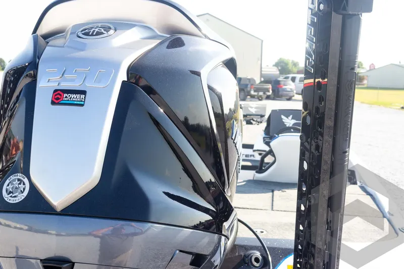 Slide: The Image of 2027 Skeeter FXE21 Limited boat engine with Power Implements branding and ultra-low emissions sticker. - 14