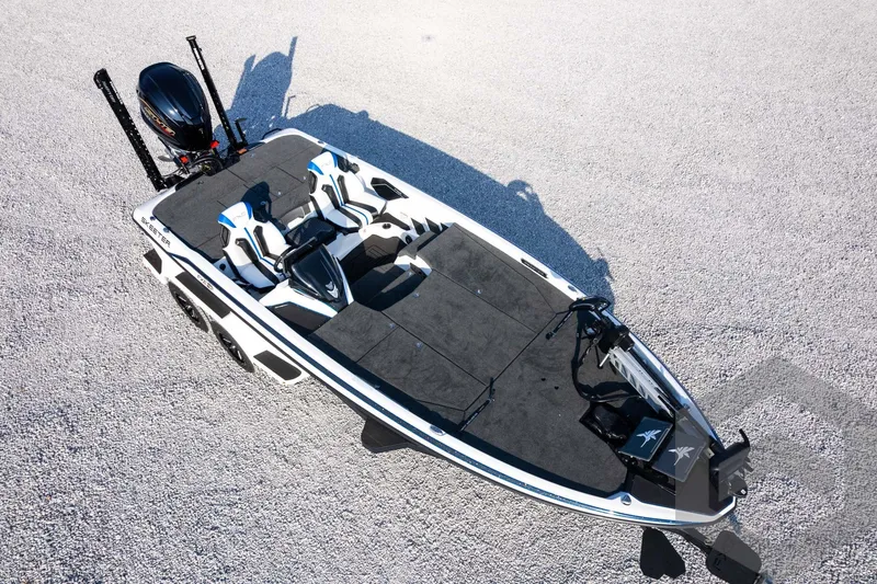 Slide: The Image of 2027 Skeeter FXE21 Limited fishing boat on gravel surface, aerial view. - 37