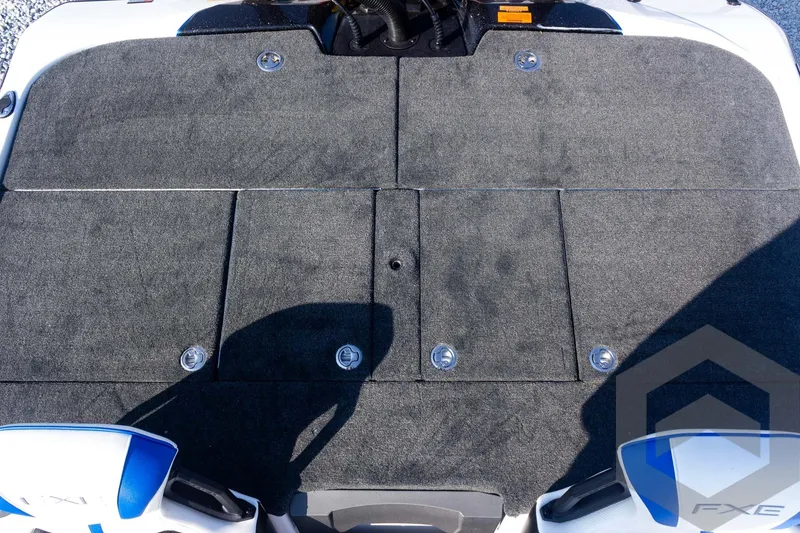 Slide: The Image of 2027 Skeeter FXE21 Limited boat deck with storage compartments and logo. - 24