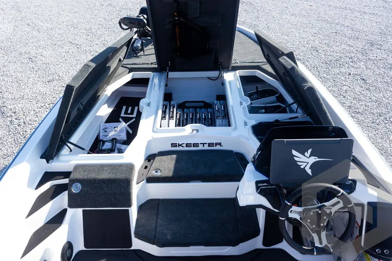 Slide: The Image of 2027 Skeeter FXE21 Limited boat interior with advanced controls and storage compartments. - 18