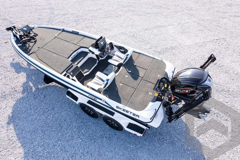 Slide: The Image of 2027 Skeeter FXE21 Limited boat with Yamaha engine on gravel surface. - 33