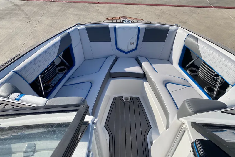 Slide: The Image of Interior of 2018 Nautique Super Air Nautique G21 boat with sleek seating and cup holders. - 32