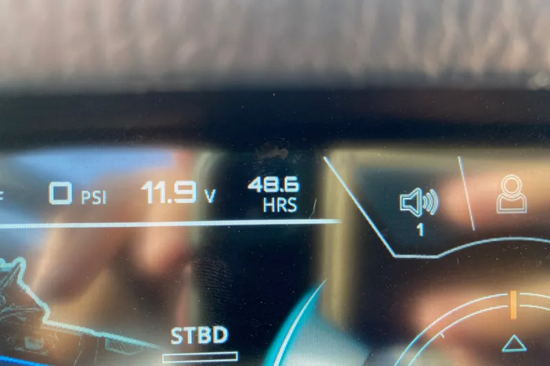 Slide: The Image of Close-up of 2018 Nautique Super Air Nautique G21 dashboard display showing 48.6 hours and 11.9 volts. - 31