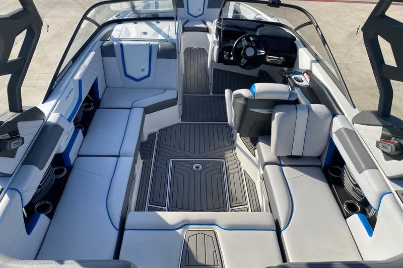 Slide: The Image of 2018 Nautique Super Air Nautique G21 interior with sleek seating and modern dashboard design. - 26