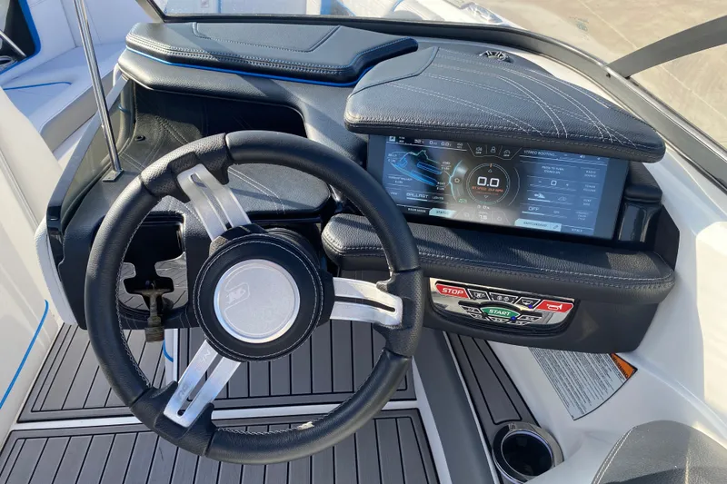 Slide: The Image of Steering wheel and dashboard of 2018 Nautique Super Air Nautique G21 boat. - 29